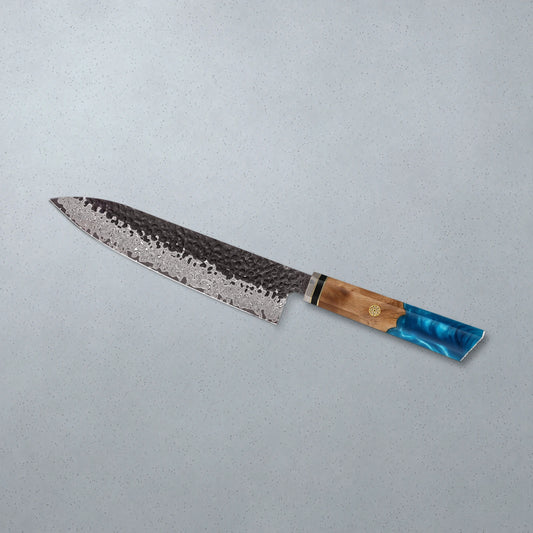 The Glacier chef knife on pale grey stone