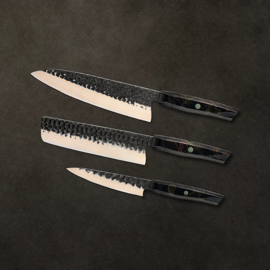 The Obsidian Prep Trio on dark basalt stone